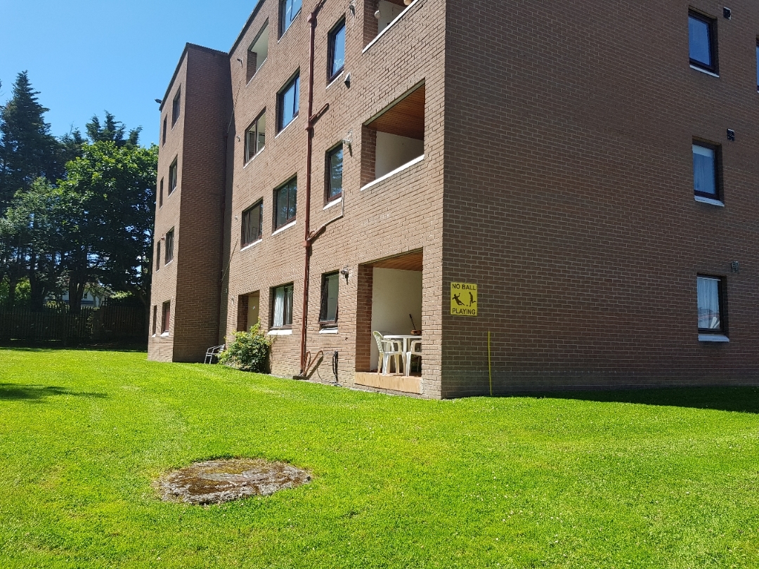 Cherbury apartments surrounded by grass and trees